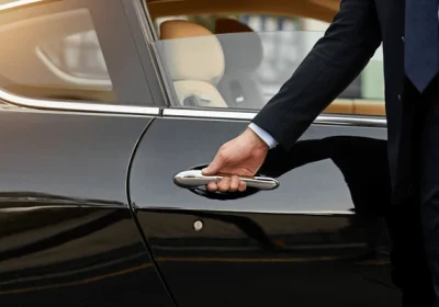 businessman-hands-chauffeur-by-car-600nw-2315443469